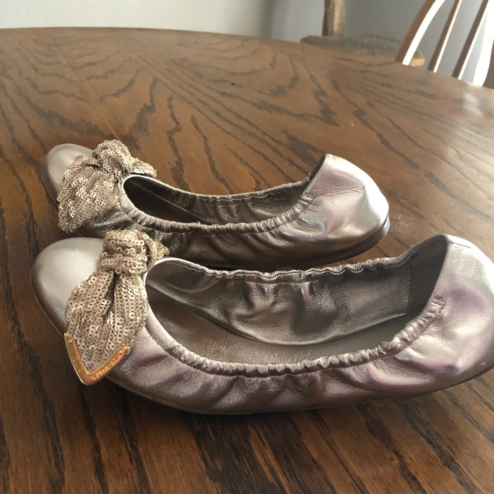 Louis Vuitton golden leather flats.